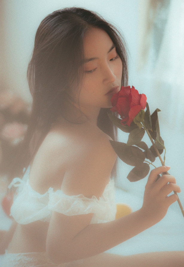 Photo Of Woman Holding Red Rose